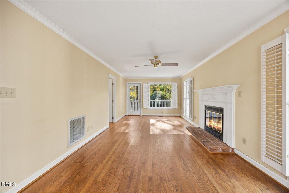 800 Temple Street Raleigh, NC 27609 - Photo 7 of 37 wooden floor in an empty room with a window