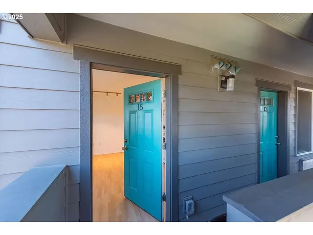 a kitchen with stainless steel appliances granite countertop a stove a refrigerator and a sink with wooden cabinets