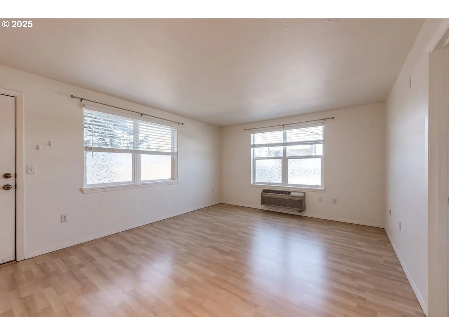 10345 Northeast Clackamas Street, Unit 15 Portland, OR 97220 - Photo 6 of 14 a view of an empty room with a window