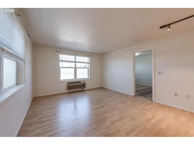 a view of an empty room with a window