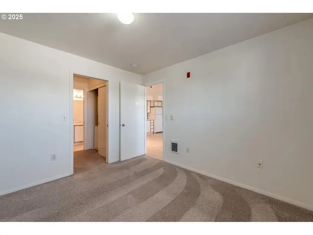a bathroom with a shower and a sink