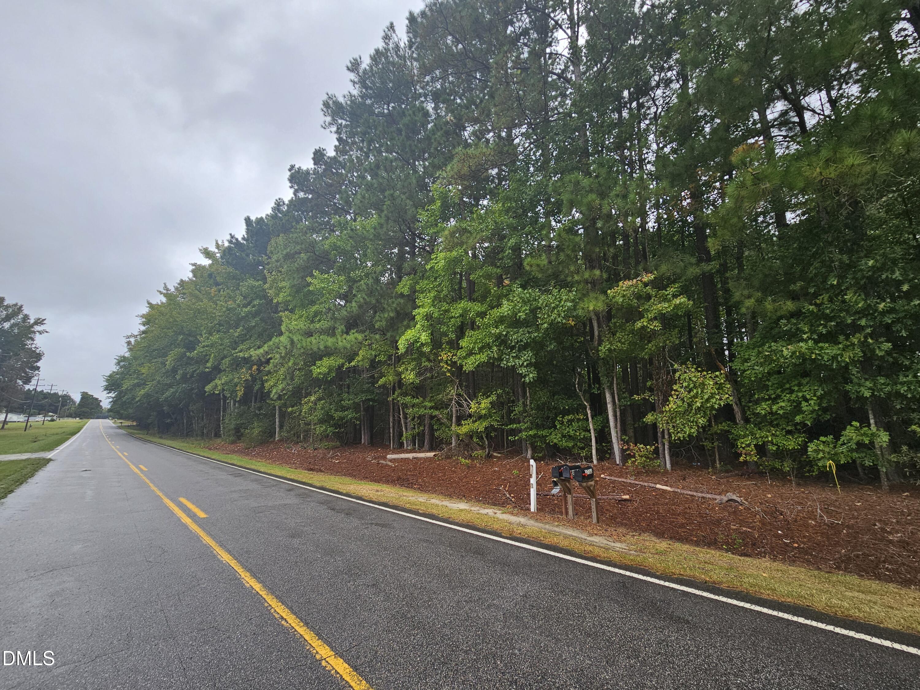 0 Nc-231 Middlesex, NC 27557 - Photo 7 of 9 a view of a field with trees in the background