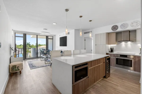 a kitchen with stainless steel appliances granite countertop a stove and a sink