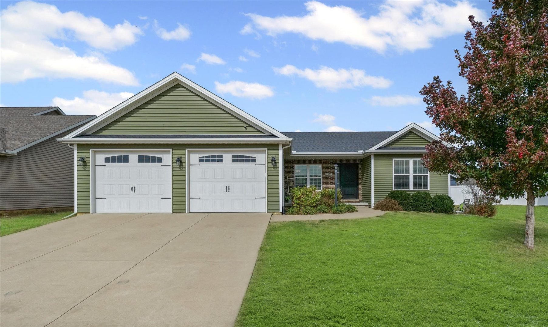 2022 Prairie Grass Lane Mahomet, IL 61853 - Photo 1 of 51 a front view of a house with a yard and trees