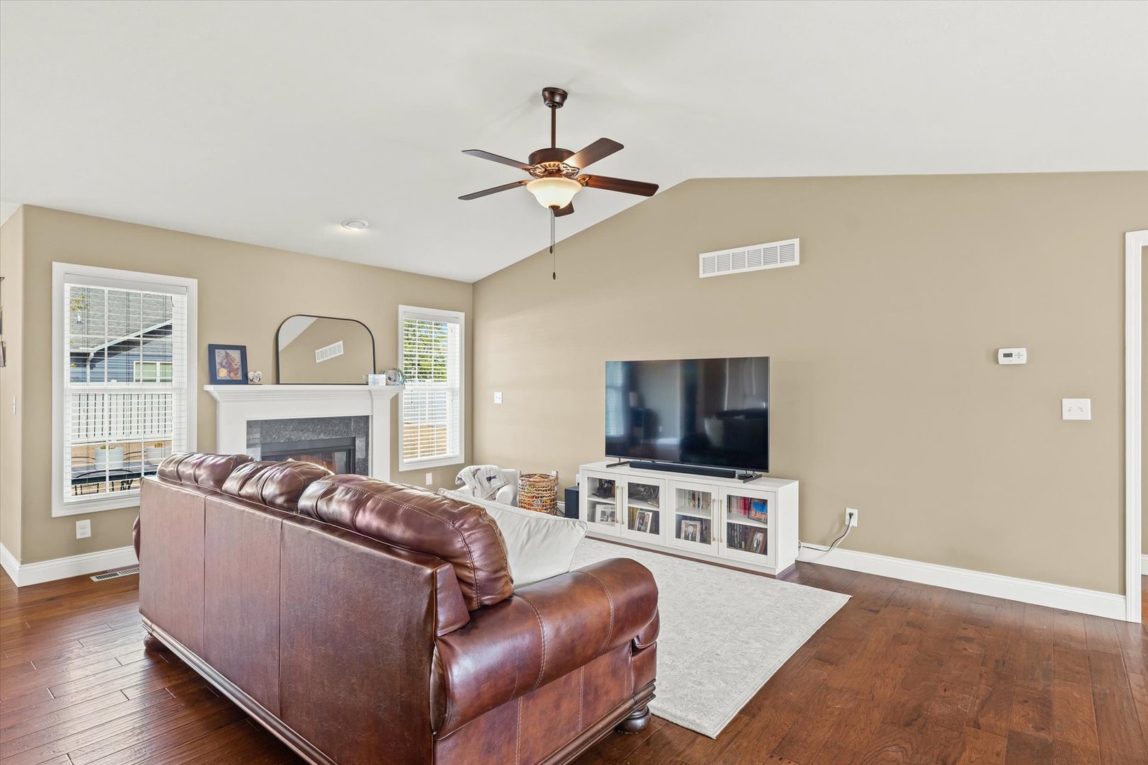 2022 Prairie Grass Lane Mahomet, IL 61853 - Photo 11 of 51 a living room with furniture and a flat screen tv