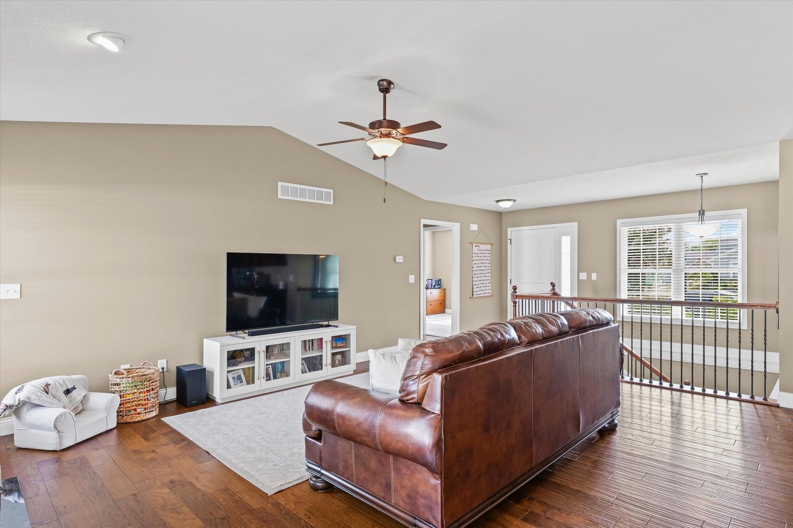 2022 Prairie Grass Lane Mahomet, IL 61853 - Photo 12 of 51 a living room with furniture and a flat screen tv