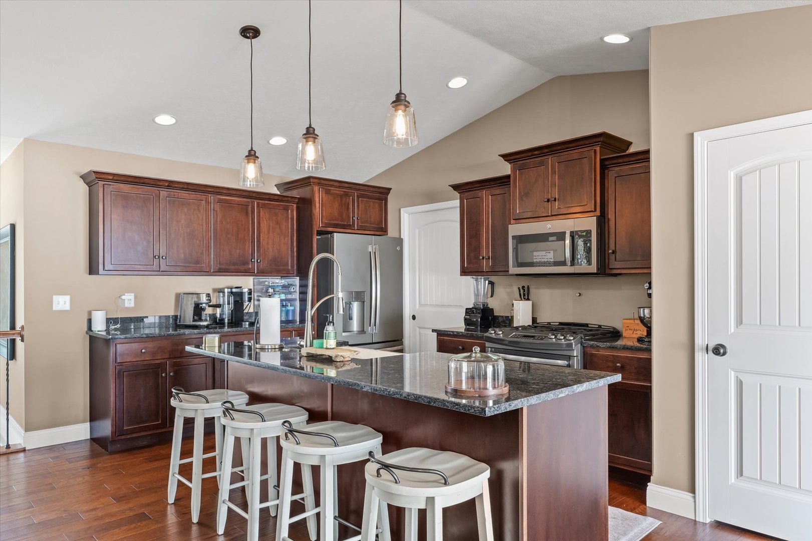 2022 Prairie Grass Lane Mahomet, IL 61853 - Photo 16 of 51 a kitchen with granite countertop a sink stove and refrigerator