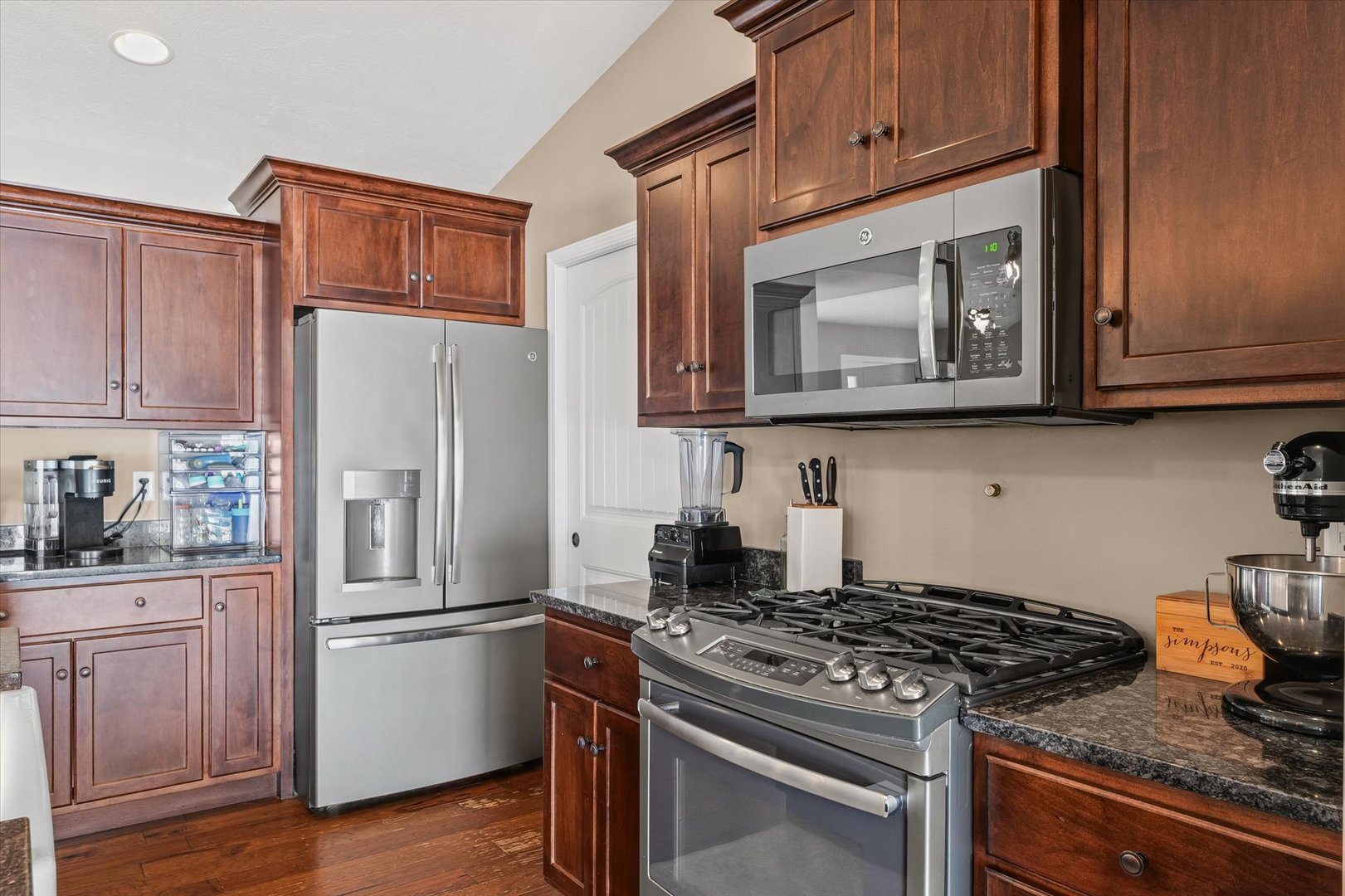 2022 Prairie Grass Lane Mahomet, IL 61853 - Photo 18 of 51 a kitchen with stainless steel appliances granite countertop a stove a refrigerator and a microwave