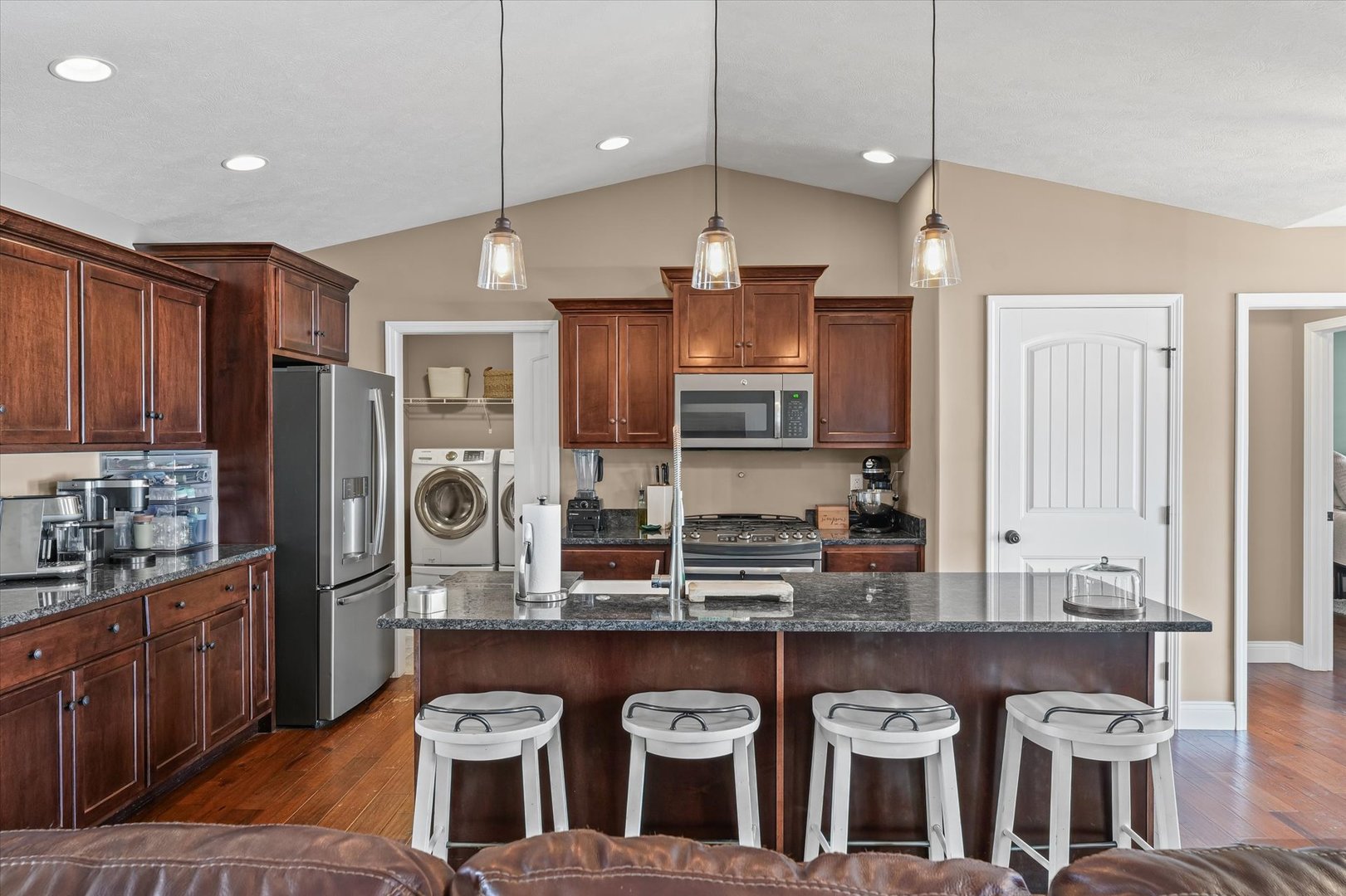 2022 Prairie Grass Lane Mahomet, IL 61853 - Photo 19 of 51 a kitchen with stainless steel appliances granite countertop a stove a sink and a refrigerator
