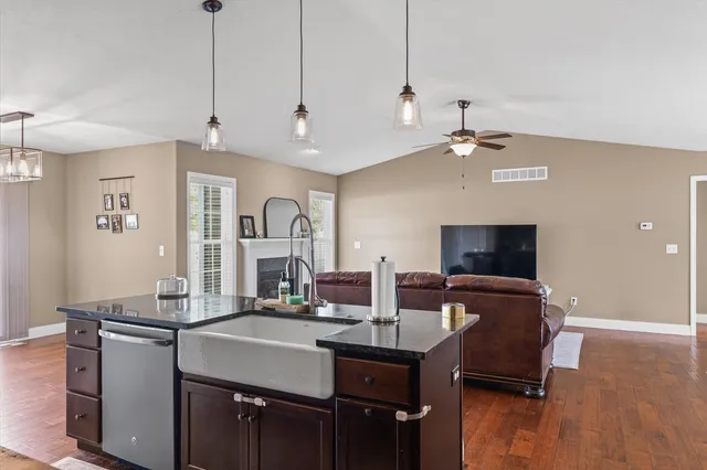 a view of a livingroom with furniture and a flat screen tv