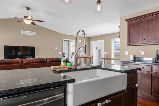 a kitchen with a sink appliances and a counter top space