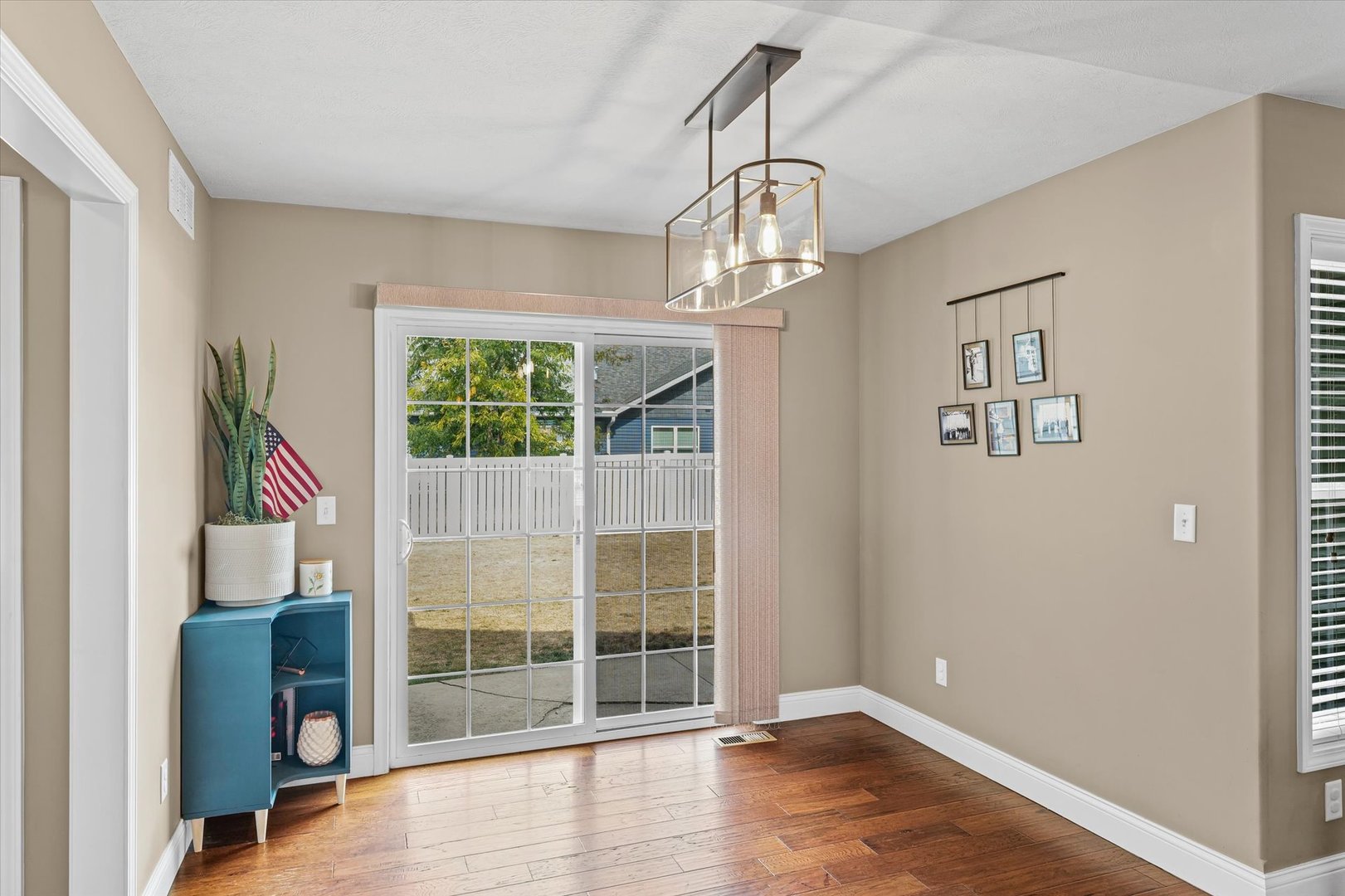 2022 Prairie Grass Lane Mahomet, IL 61853 - Photo 22 of 51 wooden floor in an empty room with a window