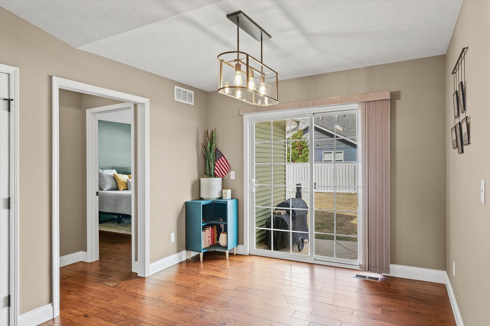 2022 Prairie Grass Lane Mahomet, IL 61853 - Photo 23 of 51 wooden floor in an empty room with a window
