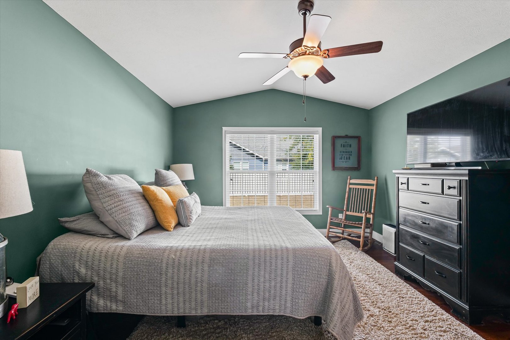 2022 Prairie Grass Lane Mahomet, IL 61853 - Photo 25 of 51 a bedroom with a bed a dresser and flat screen tv