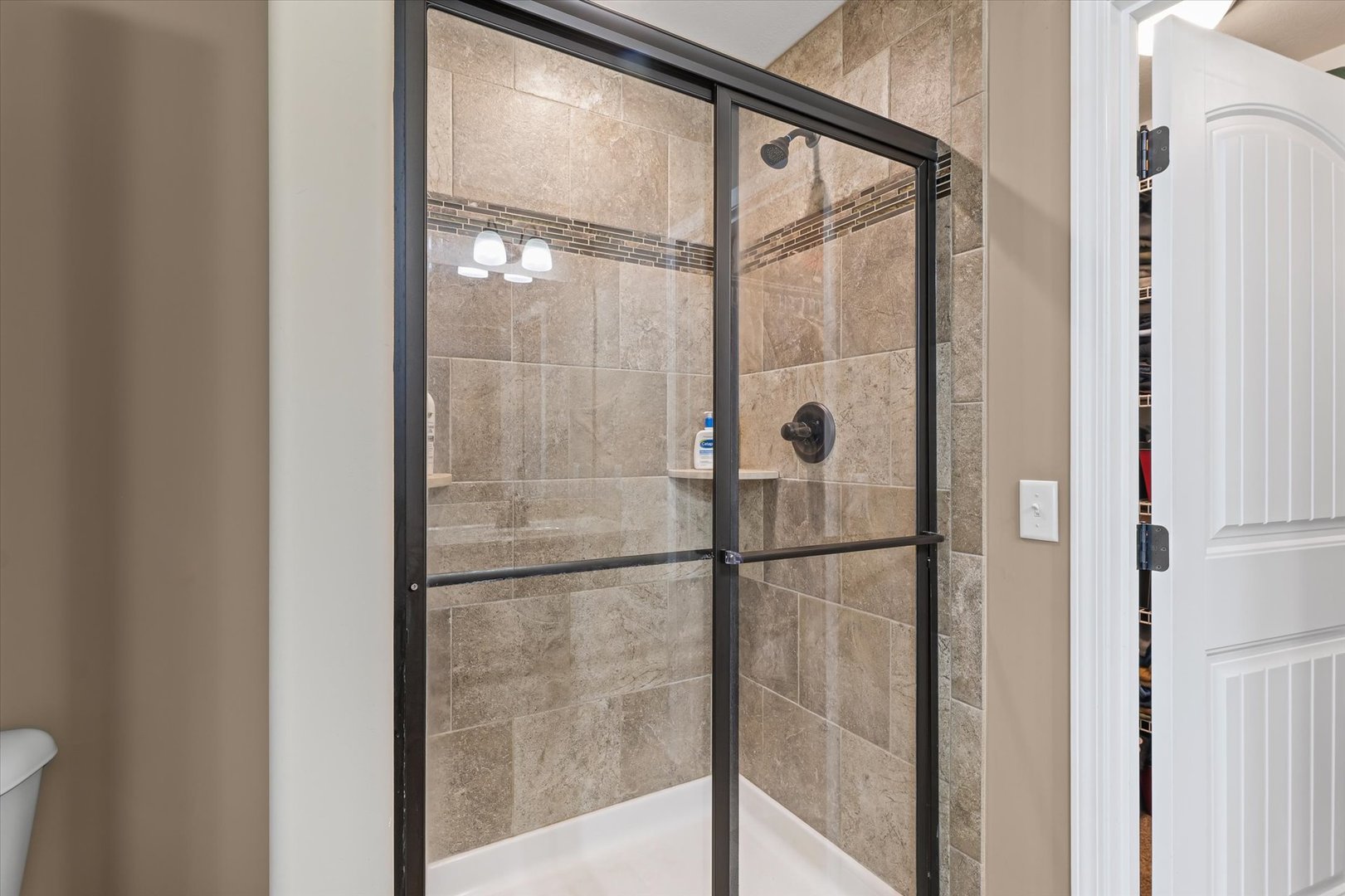 2022 Prairie Grass Lane Mahomet, IL 61853 - Photo 31 of 51 a bathroom with a glass shower door