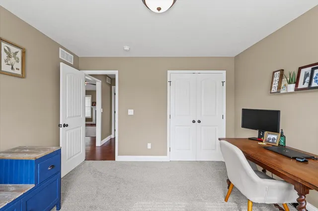 a workspace with furniture and window