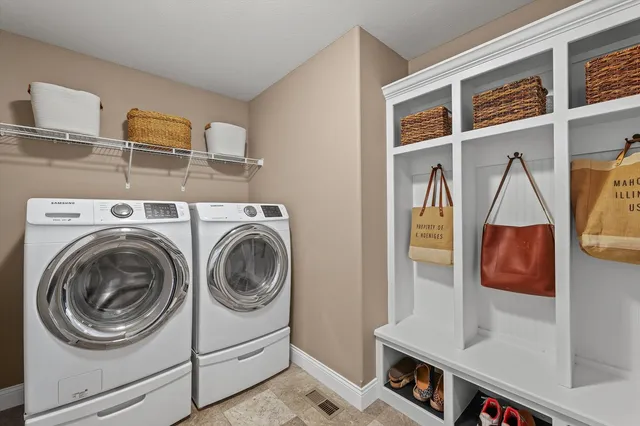 a utility room with dryer and washer