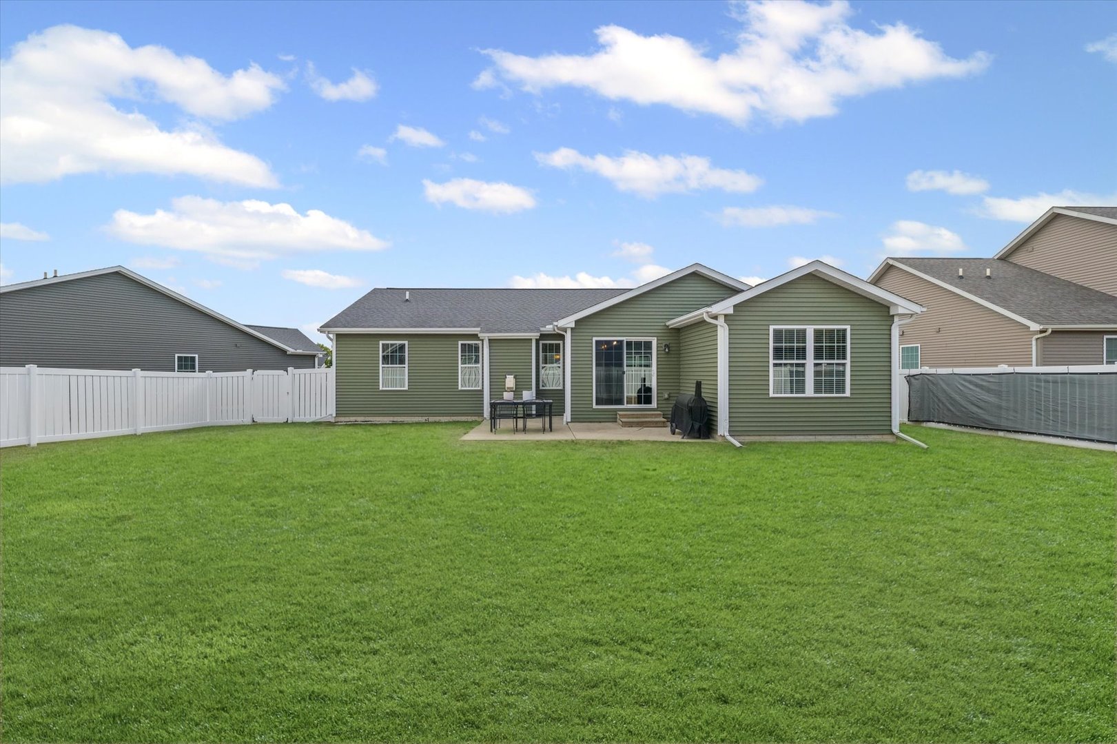 2022 Prairie Grass Lane Mahomet, IL 61853 - Photo 48 of 51 a view of a yard in front of a house with a large tree