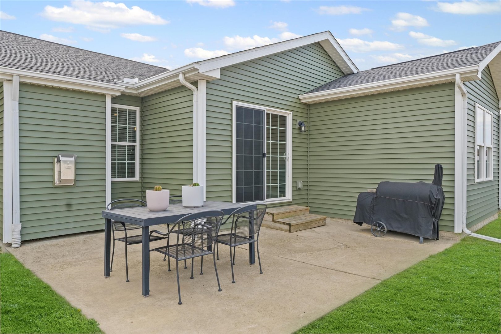 2022 Prairie Grass Lane Mahomet, IL 61853 - Photo 50 of 51 a backyard of a house with table and chairs