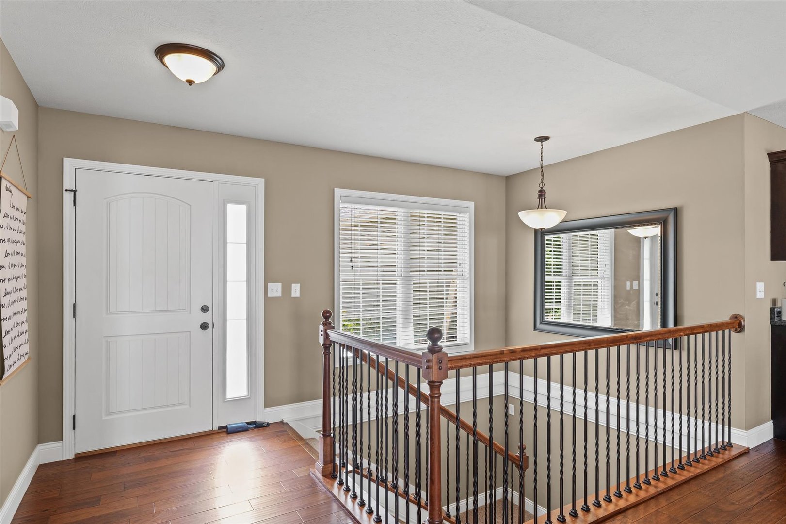 2022 Prairie Grass Lane Mahomet, IL 61853 - Photo 9 of 51 a view of an empty room with wooden floor and a window