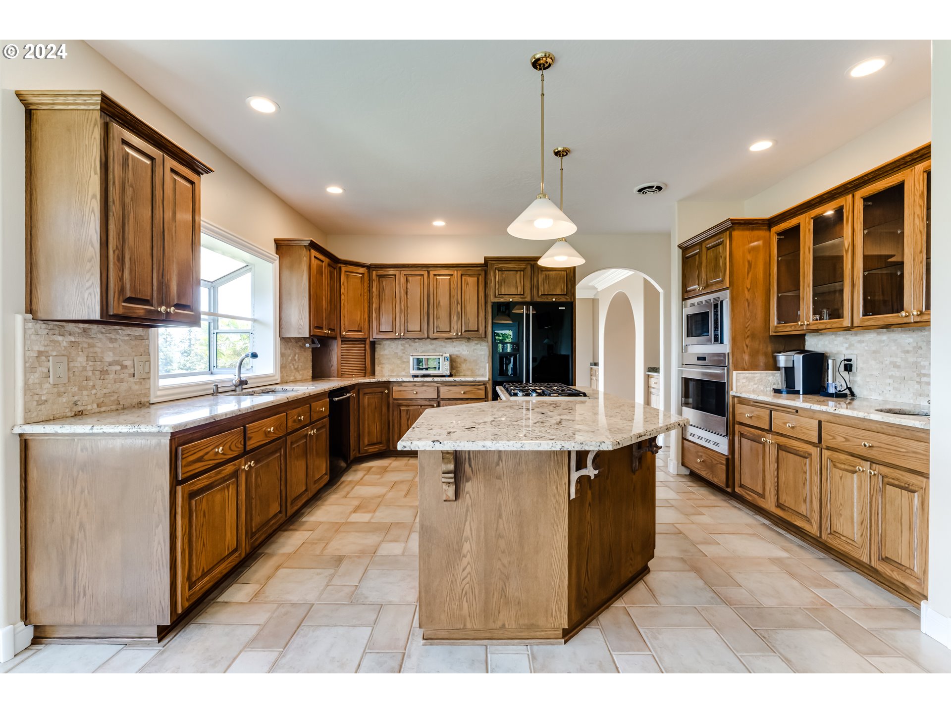 85290 Ridge Top Drive Eugene, OR 97405 - Photo 13 of 48 a large kitchen with stainless steel appliances kitchen island granite countertop a large counter top stainless steel appliances and cabinets