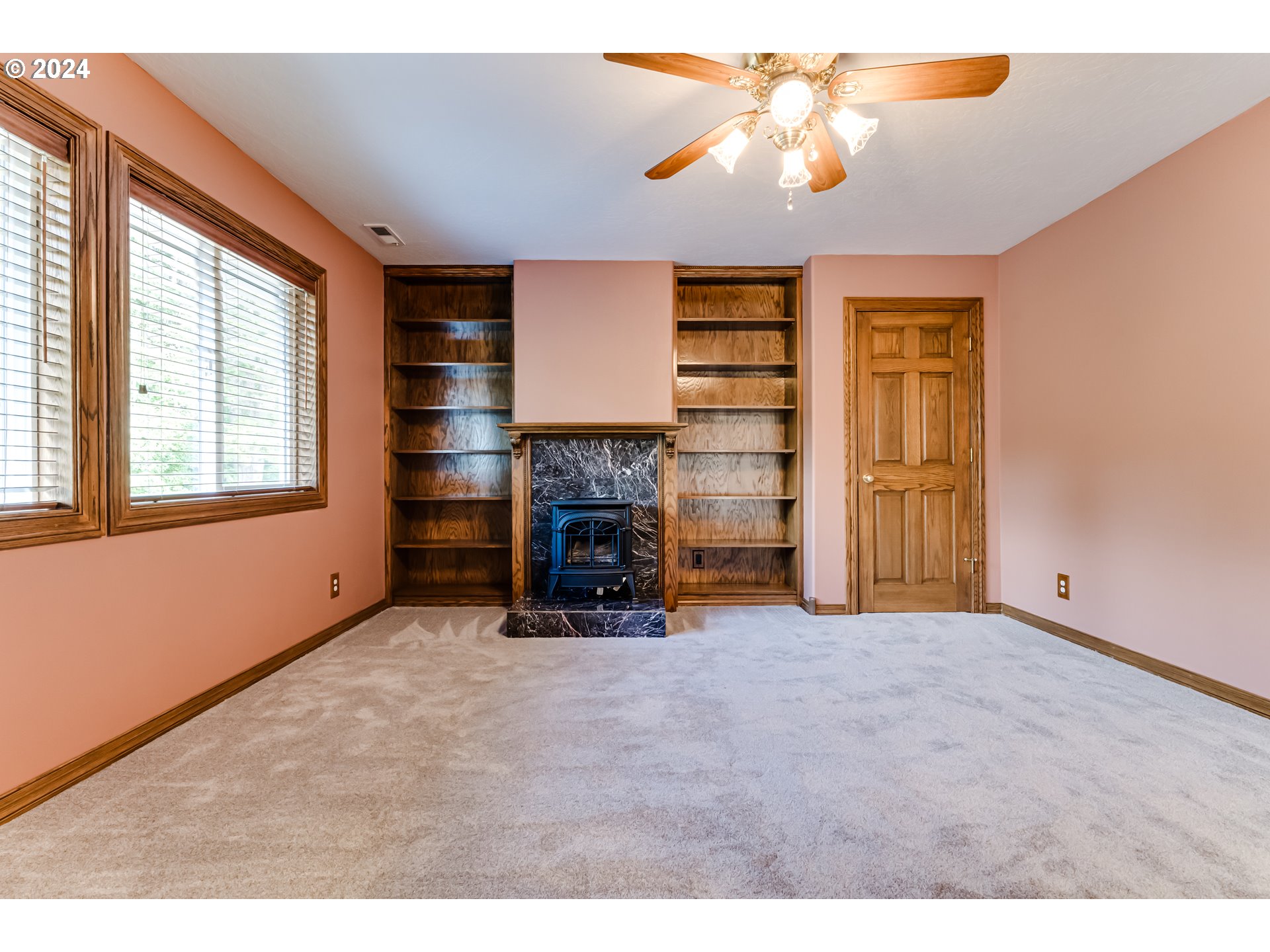 85290 Ridge Top Drive Eugene, OR 97405 - Photo 31 of 48 an empty room with windows and fireplace