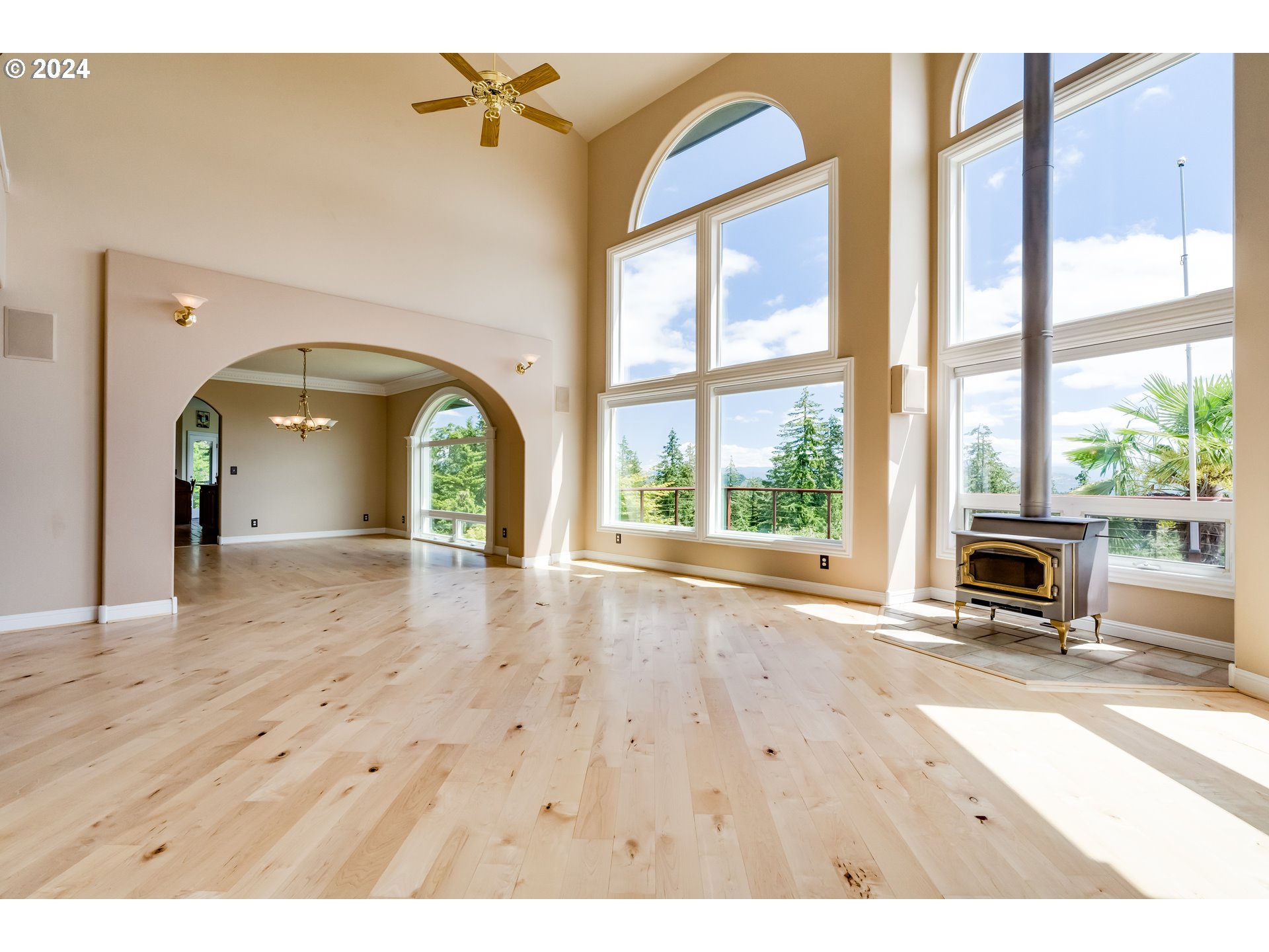 85290 Ridge Top Drive Eugene, OR 97405 - Photo 10 of 48 a view of an empty room with a window and wooden floor