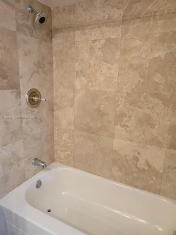 a kitchen with furniture a counter space and cabinets