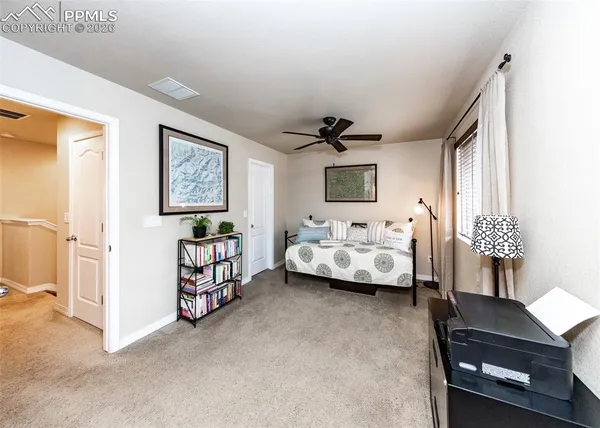 a bedroom with furniture and a window