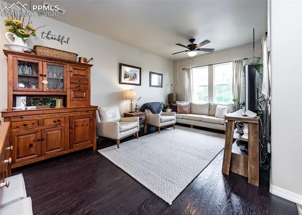 a living room with furniture and a flat screen tv