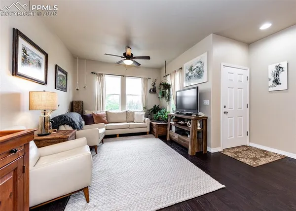 a living room with furniture and a flat screen tv