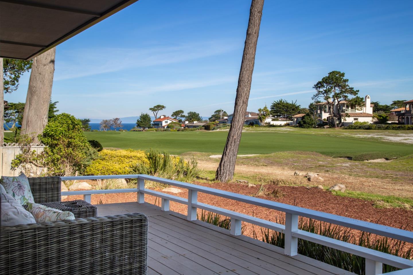 2972 Cormorant Road Pebble Beach, CA 93953 - Photo 11 of 26 a view of a balcony with floor to ceiling windows yard and a table