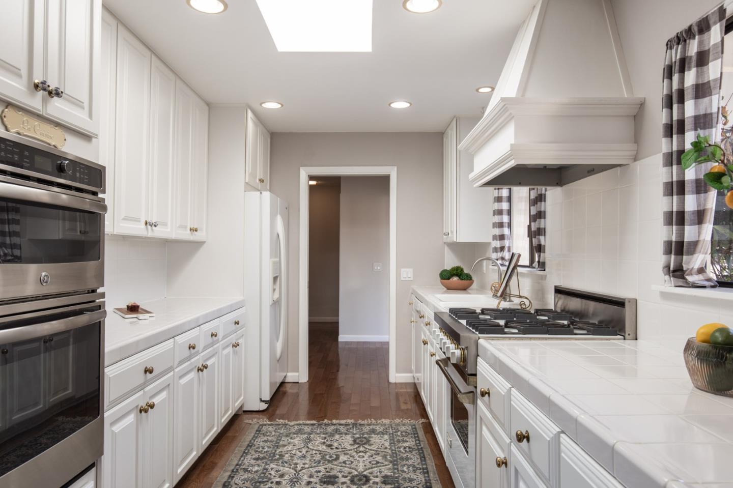 2972 Cormorant Road Pebble Beach, CA 93953 - Photo 12 of 26 a kitchen with cabinets and appliances