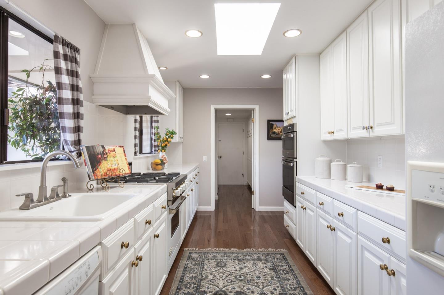 2972 Cormorant Road Pebble Beach, CA 93953 - Photo 13 of 26 a large kitchen with stainless steel appliances granite countertop a sink and cabinets