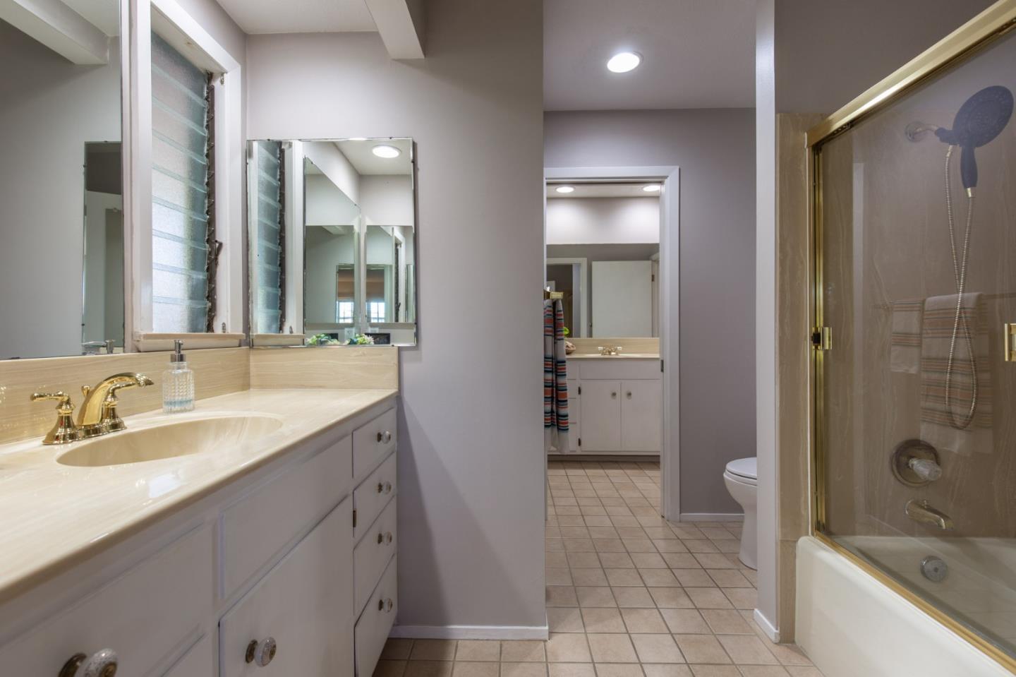 2972 Cormorant Road Pebble Beach, CA 93953 - Photo 16 of 26 a spacious bathroom with a granite countertop sink mirror and shower