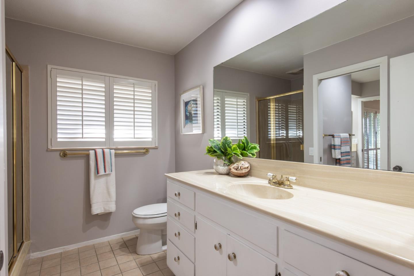 2972 Cormorant Road Pebble Beach, CA 93953 - Photo 17 of 26 a bathroom with a granite countertop sink a toilet and shower