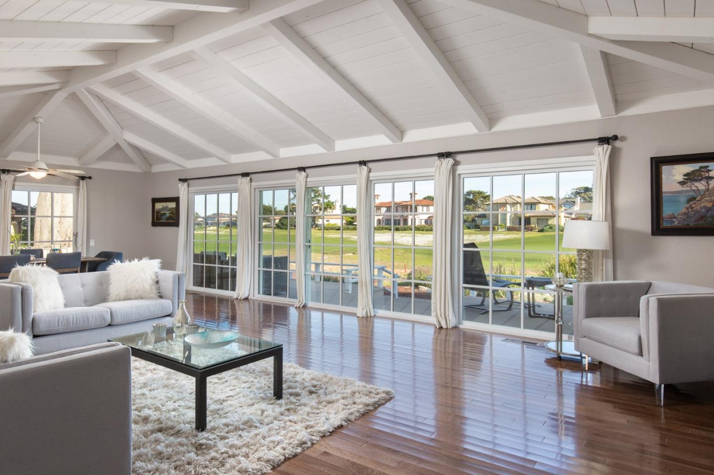 2972 Cormorant Road Pebble Beach, CA 93953 - Photo 3 of 26 a living room with furniture large windows and wooden floor