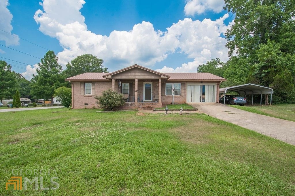 55 Swint Road Griffin, GA 30224 - Photo 1 of 1 a front view of a house with garden