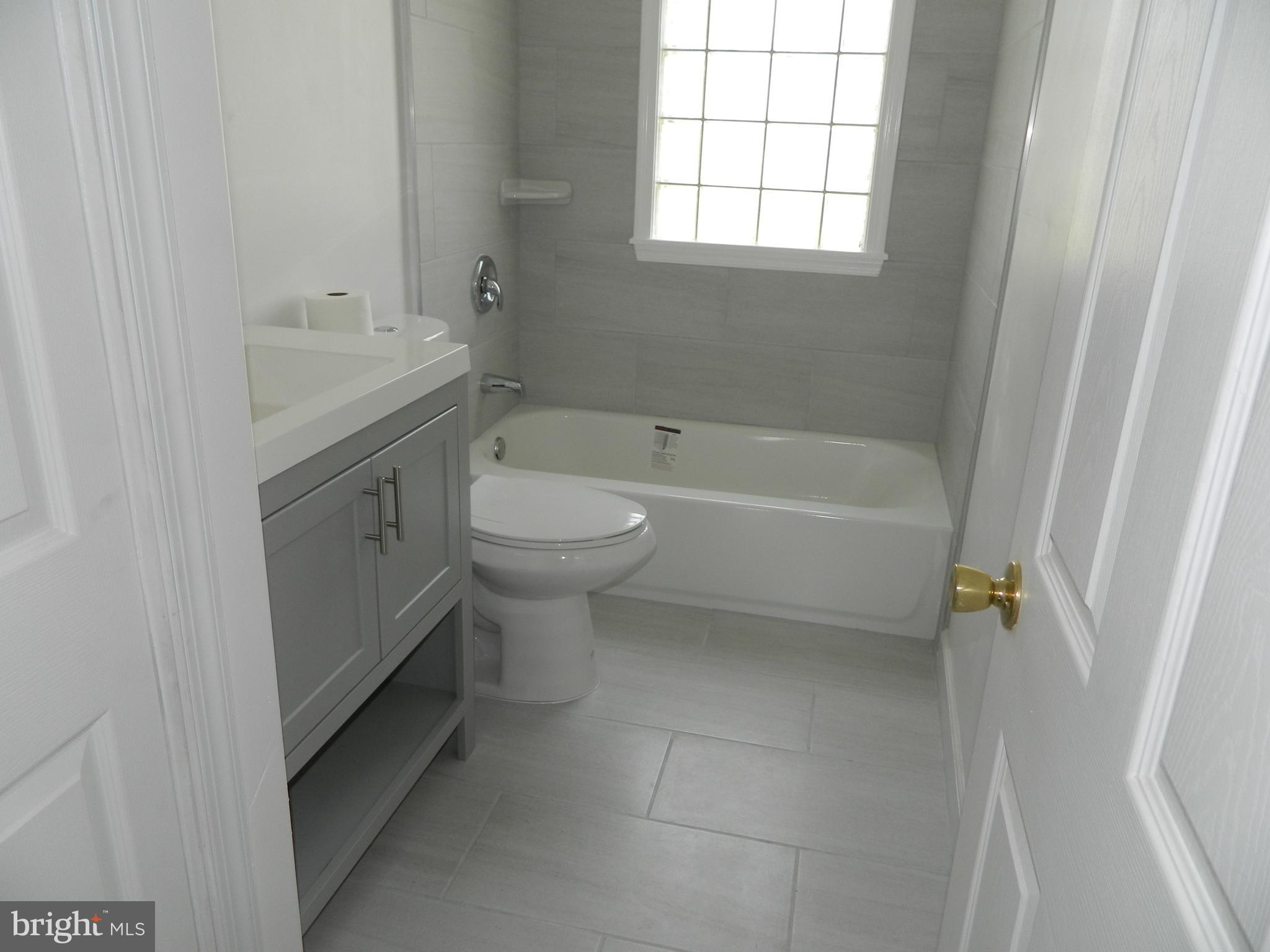962 Woodlynn Road Baltimore, MD 21221 - Photo 11 of 21 Updated bathroom