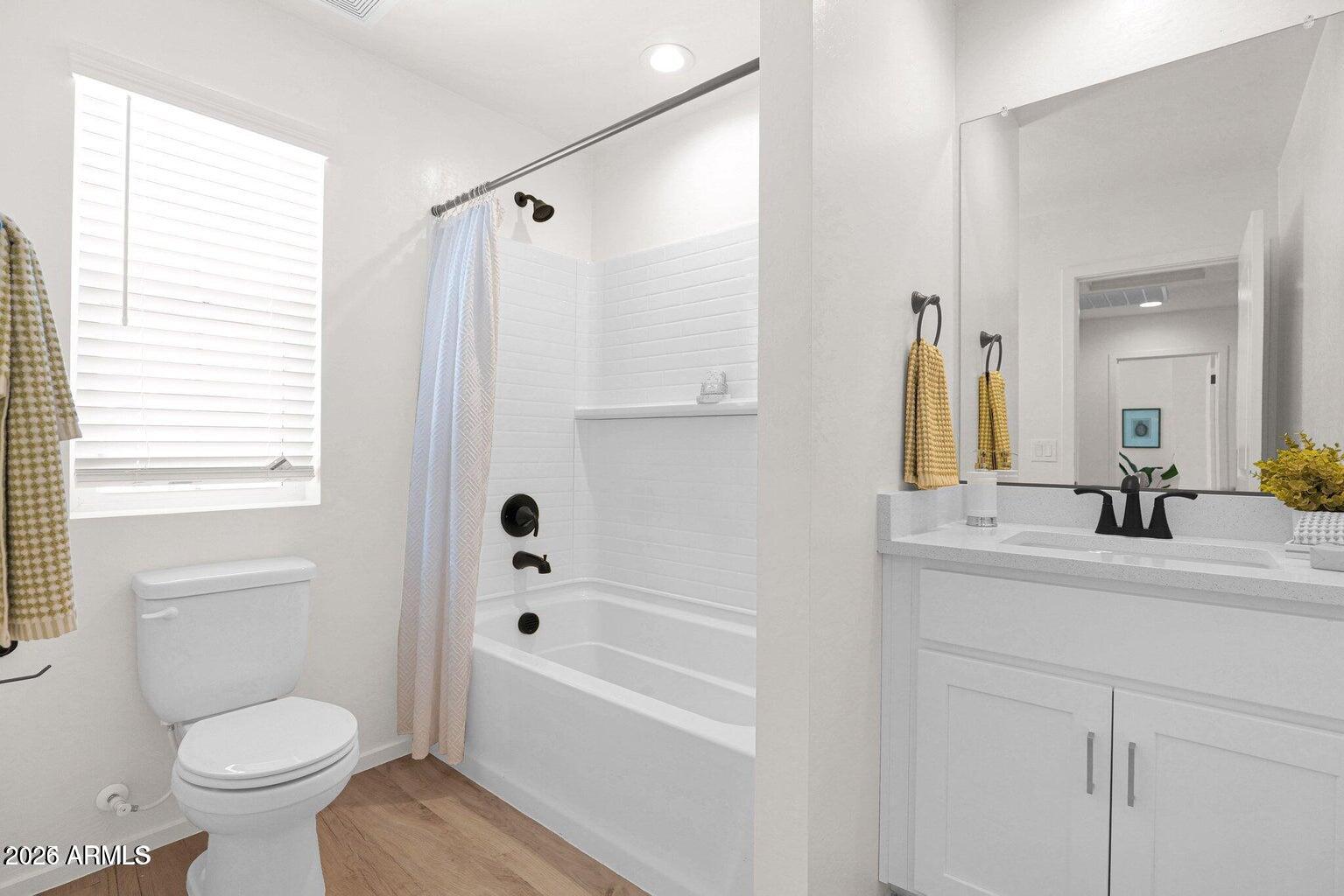 16874 North 12th Street, Unit 4 Phoenix, AZ 85022 - Photo 12 of 20 a bathroom with a sink a toilet and a bathtub