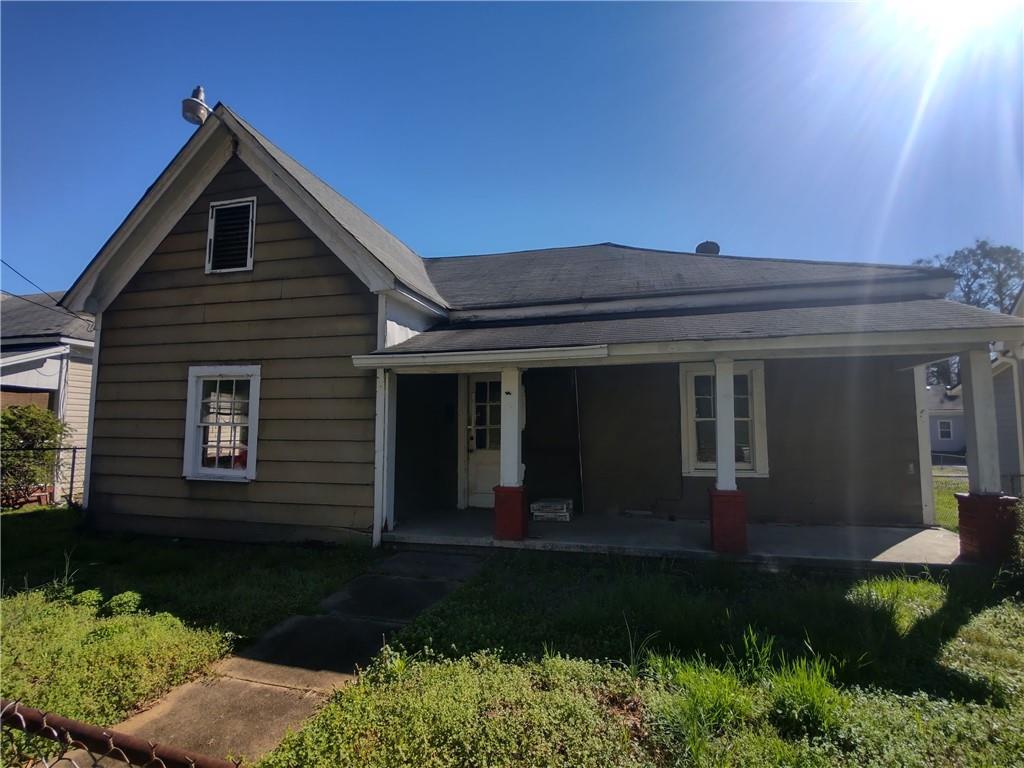 221 Cave Spring Street Southwest Rome, GA 30161 - Photo 1 of 1 a front view of a house with a yard