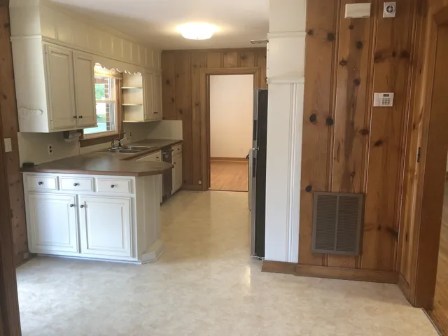 a bathroom with a granite countertop sink mirror and a