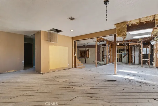 a view of a hall with wooden floor