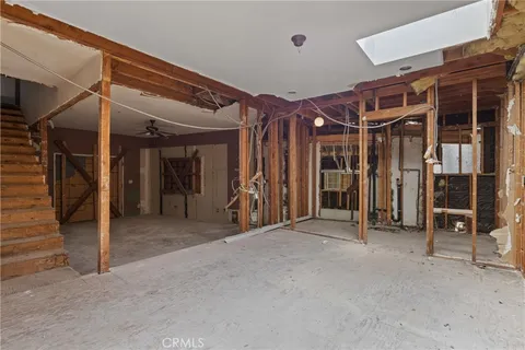 a view of the room with wooden floor