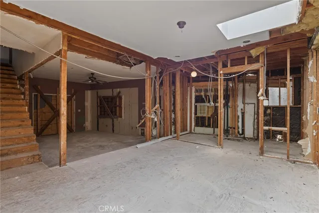 a view of the room with wooden floor