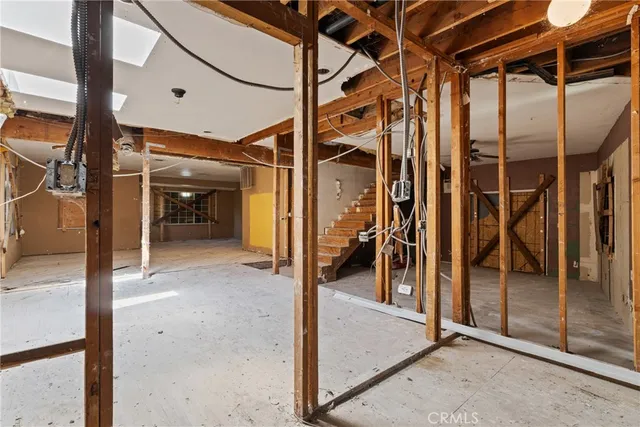a view of a room with wooden floor