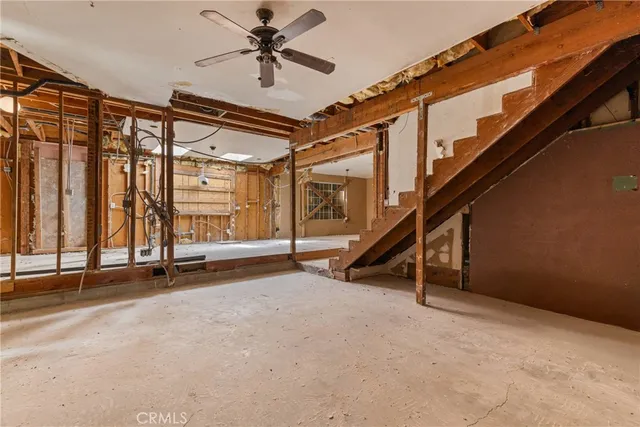 a view of an empty room with stairs