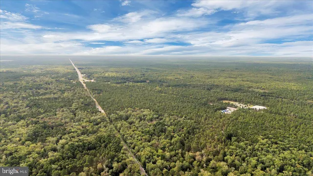 a view of a yard with an outdoor seating