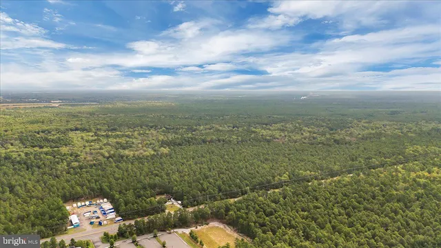 a view of a lake with houses in back