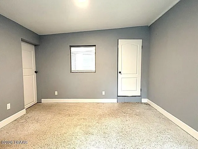 a view of an empty room with window